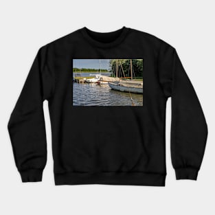 Boats moored on Hickling Broad in the Norfolk Broads National Park Crewneck Sweatshirt